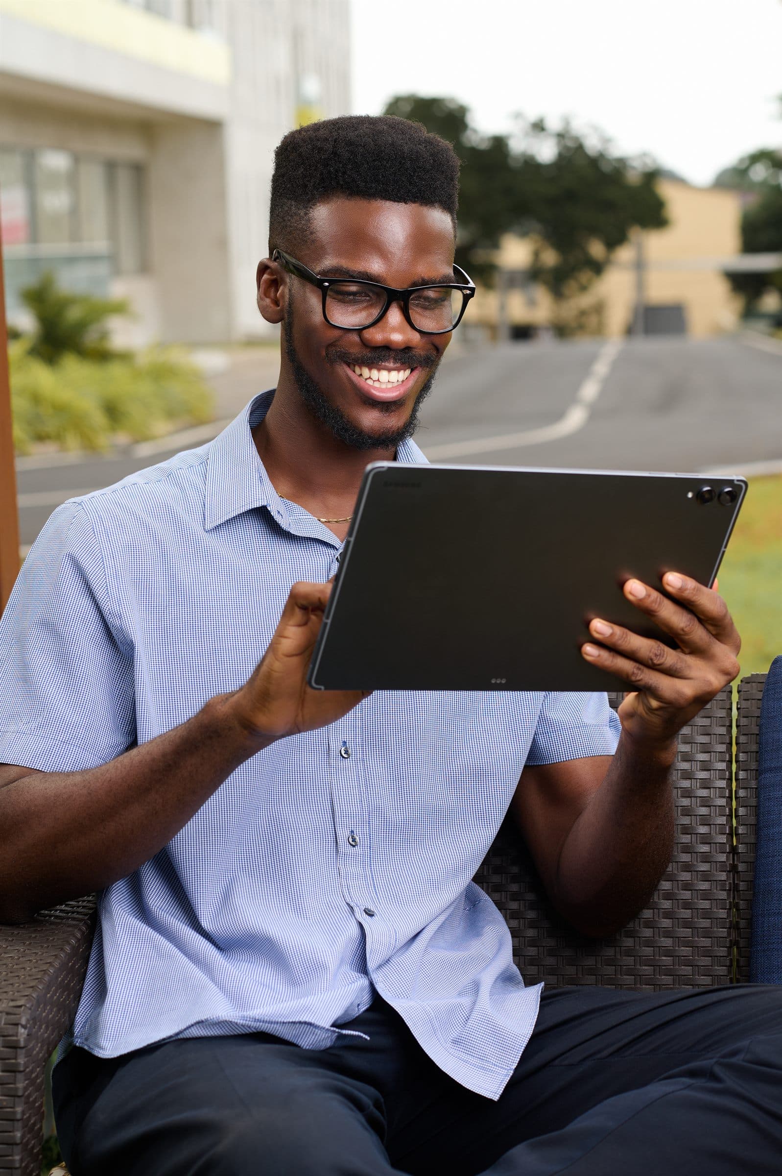 Man working on a tablet outdoors
