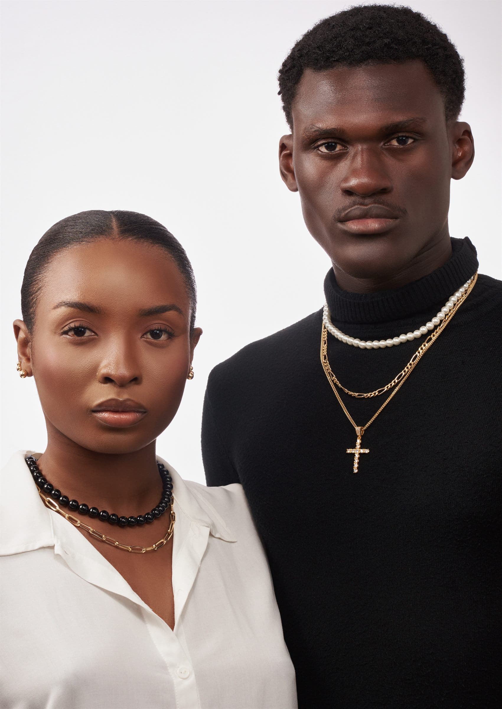 Pair portrait, gold chains and a cross pendant