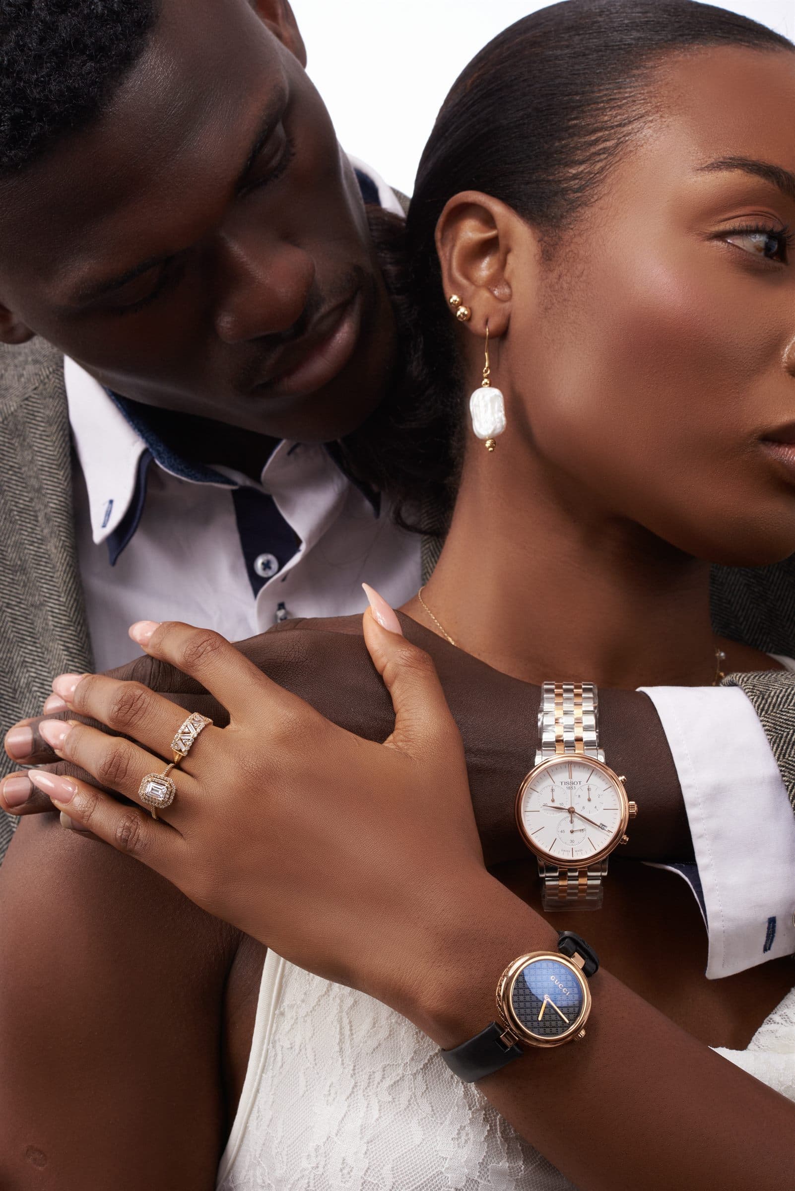 Close crop on paired watches and rings